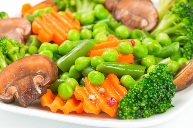 Steamed vegetables carrots broccoli peas green beans