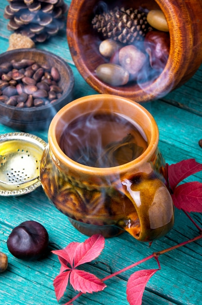 Steaming cup of autumn tea