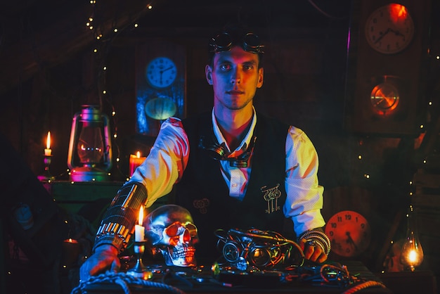 Steampunk person inventor in a suit at a table with various mechanisms