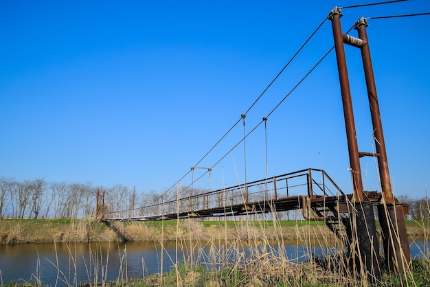 Steel bridge and gas pipeline through irrigation canal