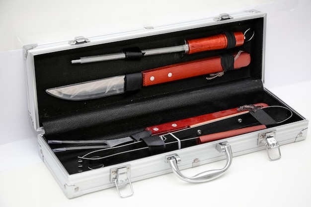 Steel case with barbecue knives.