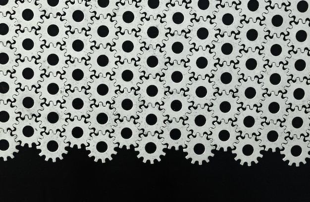 Photo steel gears laid out to each other on a black background