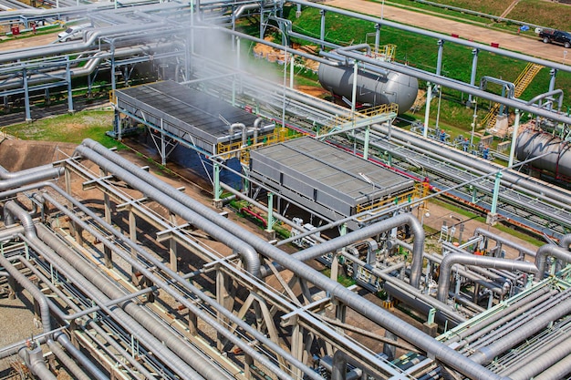 Steel long pipes flowing symbol and pipe elbow in station oil factory during refinery Petrochemistry industry in gas site