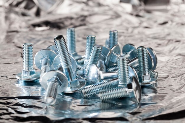 Photo steel metal bolts for construction and installation work, bolts for screwing nuts