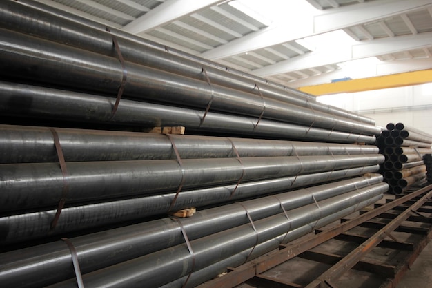 Steel metal pipe stack inside factory