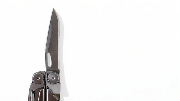 A steel multitool with an open knife blade lies on a white background pocket open folding knife