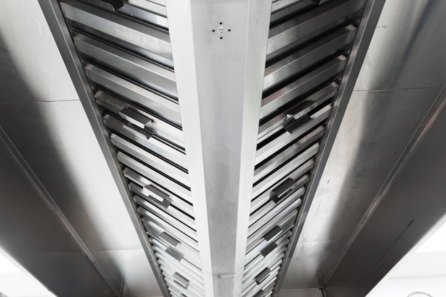 Steel shiny clean cooker hood in a restaurant