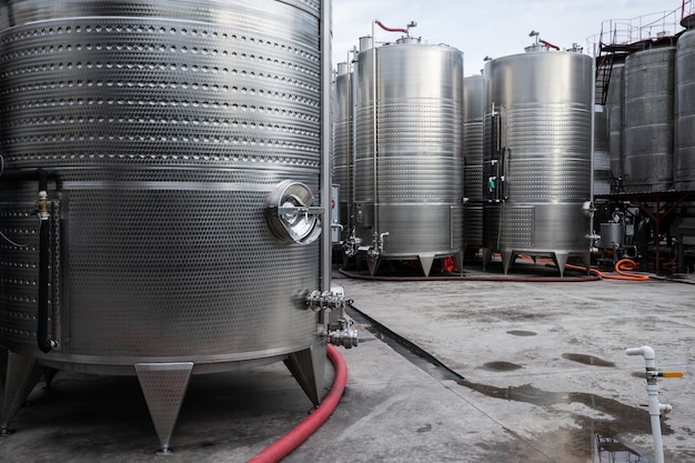 Steel tanks for winery fermentation outdoor on the wine factory yard