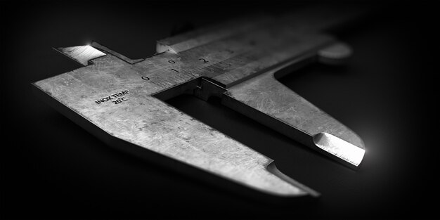 steel vernier caliper on black background