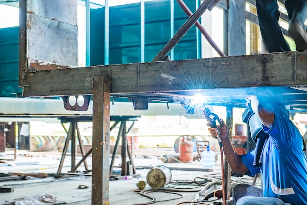 Steel welding of the beam under the truck such skillful\
crafting to joint the high strength steel bar picture also shows\
leaf spring those specially designed for the truck