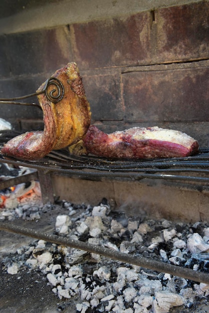 Steer meat on the grill traditional Argentine cuisine Asado barbecue Patagonia Argentina