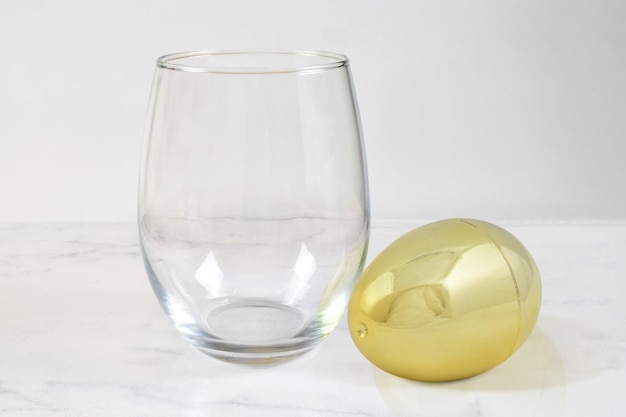 Stemless Wineglass Mockup with Gold Egg