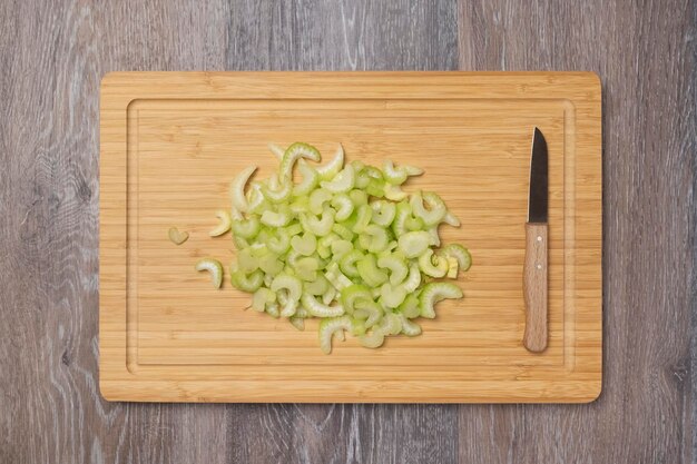 Stems of fresh juicy celery are sliced