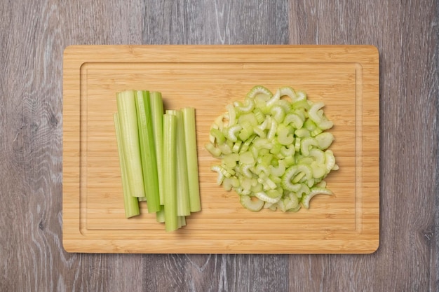 Stems of fresh juicy celery are sliced