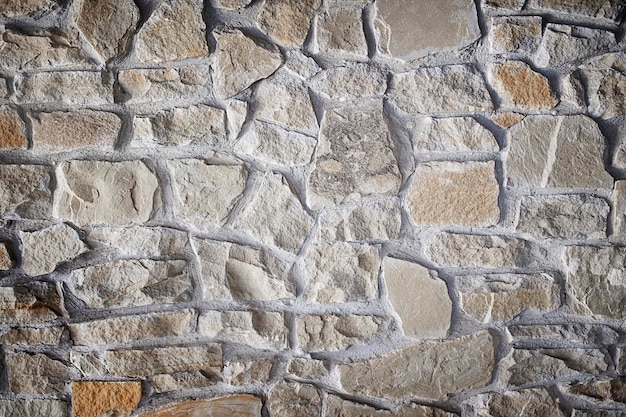 Stenen muur als achtergrond of textuur Stockafbeelding