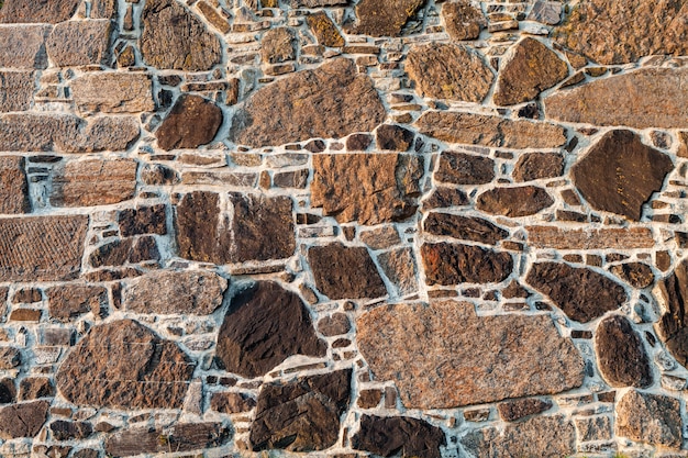 Stenen muur van geplaveide als achtergrond