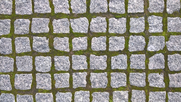 Stenen straatstenen in de vorm van een vierkant. achtergrond voor ontwerp. Hoge kwaliteit foto