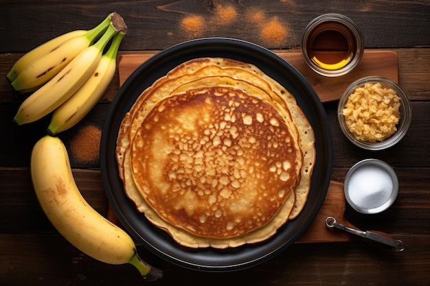 Step 2 Cooking healthy banana oatmeal pancakes with honey and banana slices on a frying pan