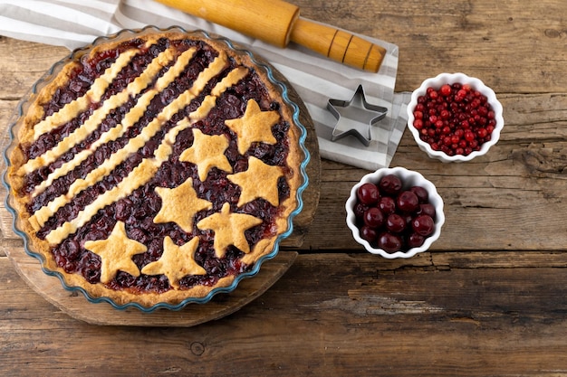 Step 4 After baking Homemade cherry pie Cake made from dough with stars Food for 4th July USA Independence Day American Pie Sweet pastries Berry open round tart DIY