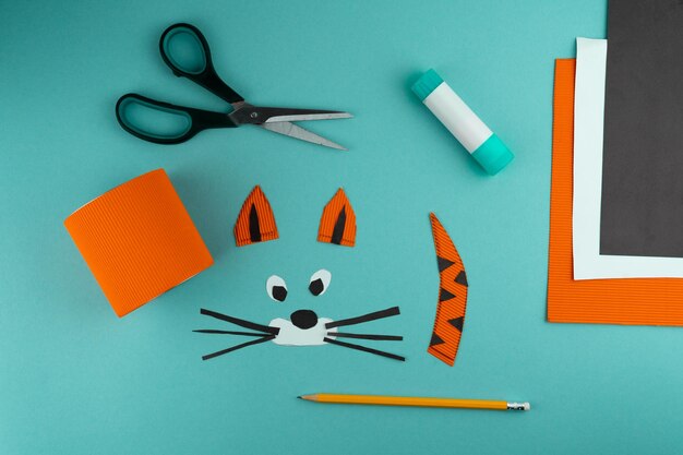 Step 5 stepbystep instructions on how to make a stand for\
stationery from a tin can tiger made of paper and cardboard\
scissors and glue a fun diy craft for children do it yourself paper\
tiger