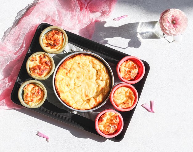 Step 9 Ready hot cheese curd muffins and a pie in a baking dish