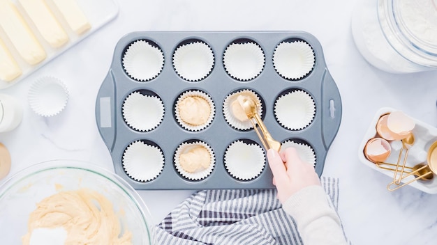 Step by step. Baking vanilla cupcakes in metal cupcake pan.