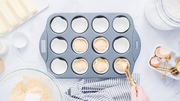 Step by step. Baking vanilla cupcakes in metal cupcake pan.