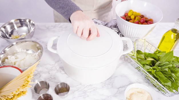 Step by step. Cooking on pot pasta recipe in an enameled cast iron dutch oven.