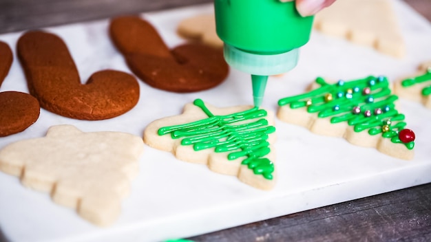 Step by step. decorating gingerbread and sugar cookies with royal icing for christmas