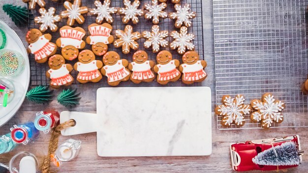 Step by step. Flat lay. Decorating gingerbread cookies with royal icing.