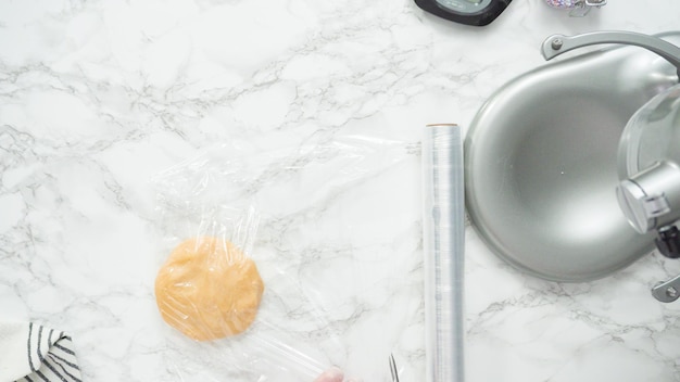Step by step. Flat lay. Mixing ingredients in standing kitchen mixer to bake sugar cookies.