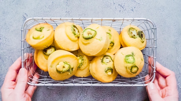 Step by step. Flat lay. Spicy jalapeno cornbread muffins in wired basket.