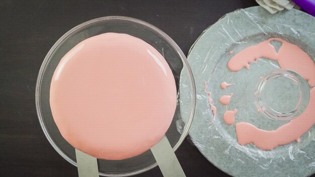 Step by step. Making mousse cake with pink mirror glaze and fresh berries.