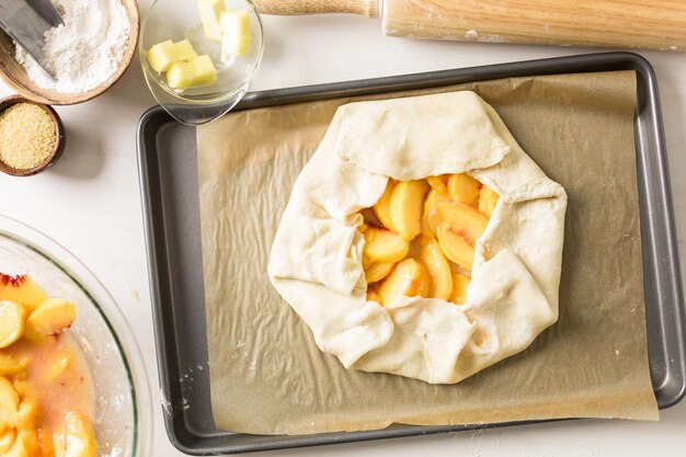 Step by step. Making peach galette with fresh local peaches.