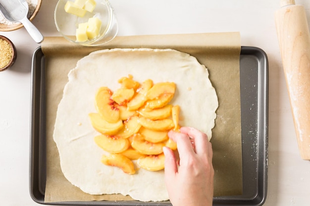 Step by step. Making peach galette with fresh local peaches.