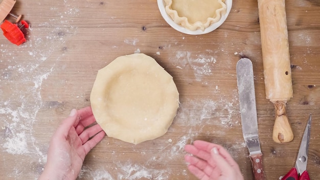 Step by step. Making pie crust from scratch to bake pumpkin pie.