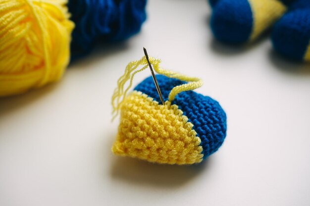 step-by-step master class on crocheting a two-color heart. step 7 of 7. finish. support ukraine in k