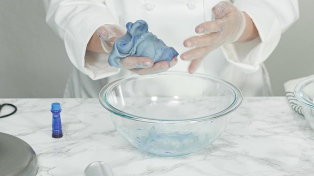 Step by step. Mixing food coloring into the cookie dough to bake red, white, and blue pinwheel sugar cookies.