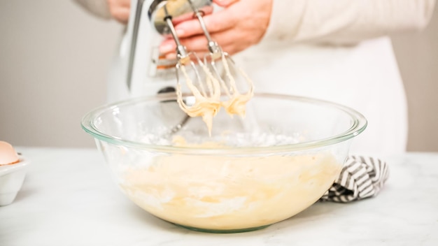 Step by step. Mixing ingredients for vanilla cupcakes.