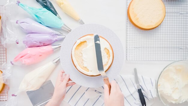 Step by step. Pastry chef making unicorn cake for little girl birthday party.