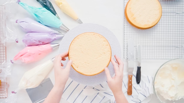 Step by step. Pastry chef making unicorn cake for little girl birthday party.