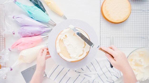 Step by step. Pastry chef making unicorn cake for little girl birthday party.