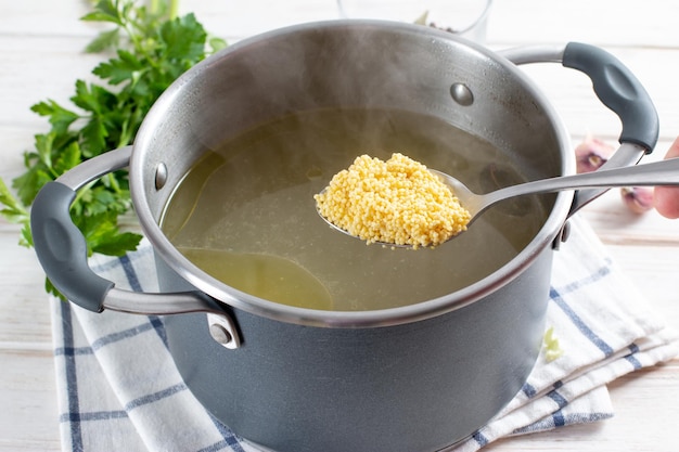 Step-by-step preparation soup with pumpkin and vegetables, step - adding millet to the broth