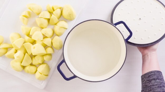 Step by step. Preparing classic mashed potatoes for Thanksgiving dinner.