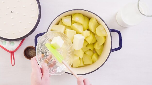 Step by step. Preparing classic mashed potatoes for Thanksgiving dinner.