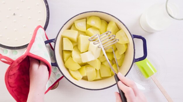 Step by step. preparing classic mashed potatoes for thanksgiving dinner