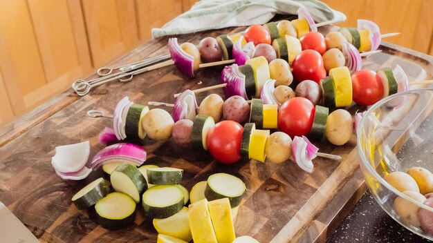 Step by step. Preparing veggie skewers for outdoor grilling.