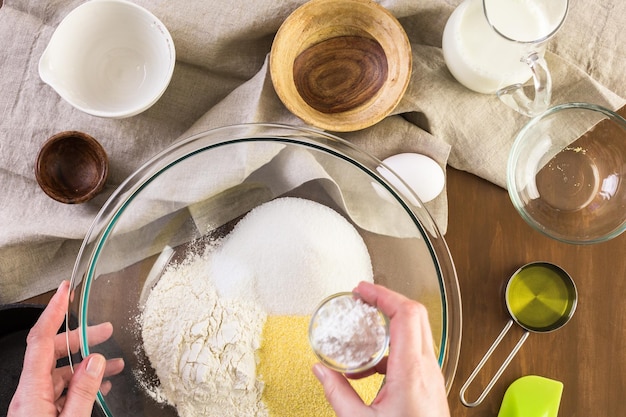 Step by step. Prepating traditional sweet cornbread from organic ingredients.