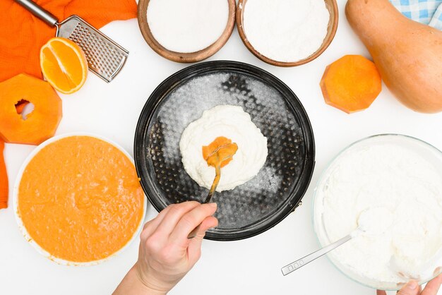 Step-by-step recipe for pumpkin curd casserole in the shape of\
a zebra, autumn pie with orange. ingredients for pumpkin pie top\
view. place alternately in a baking dish.