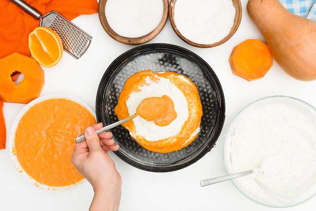 Photo step-by-step recipe for pumpkin curd casserole in the shape of a zebra, autumn pie with orange. ingredients for pumpkin pie top view. place alternately in a baking dish